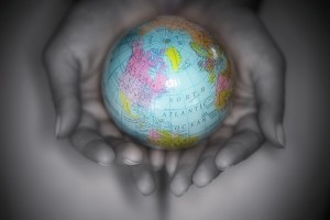 Hands Holding a Small Globe